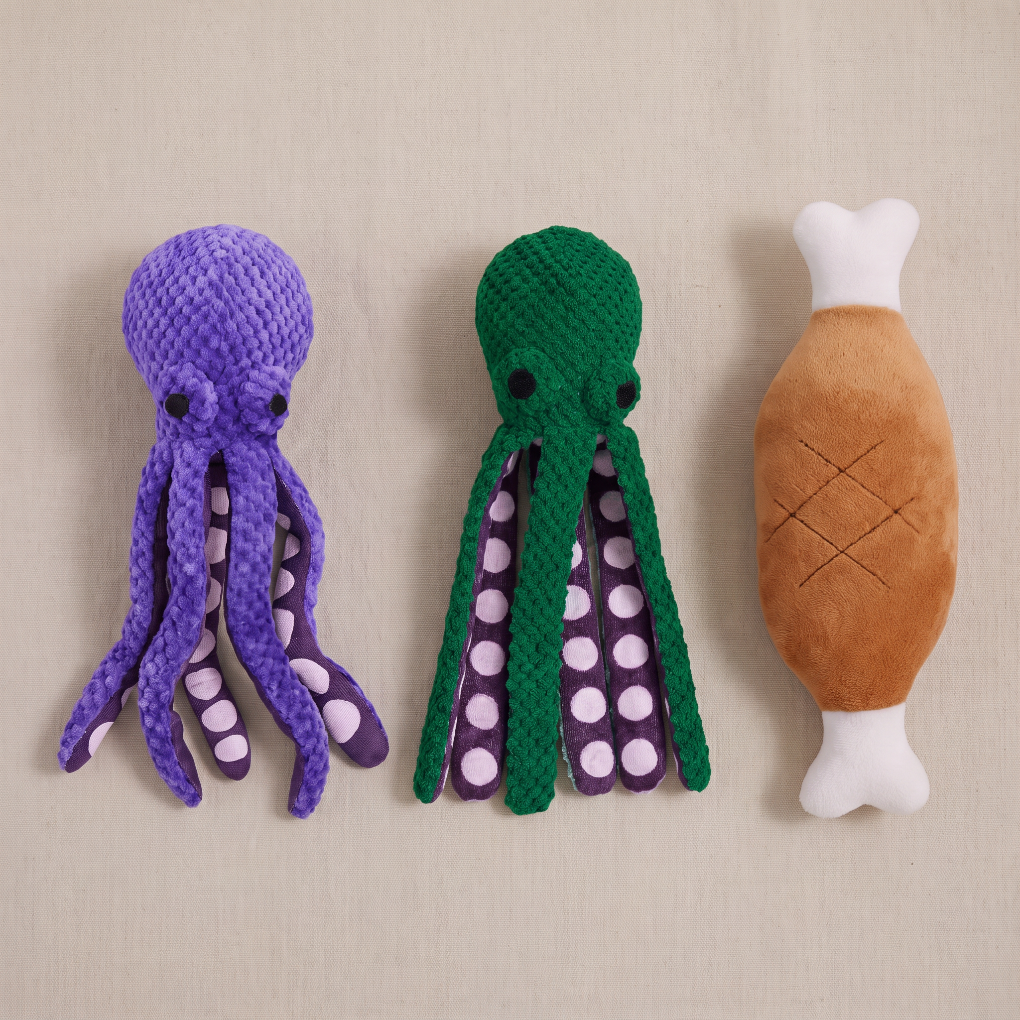 The Big Bundle three-piece flat lay - green octopus, purple octopus, chicken leg